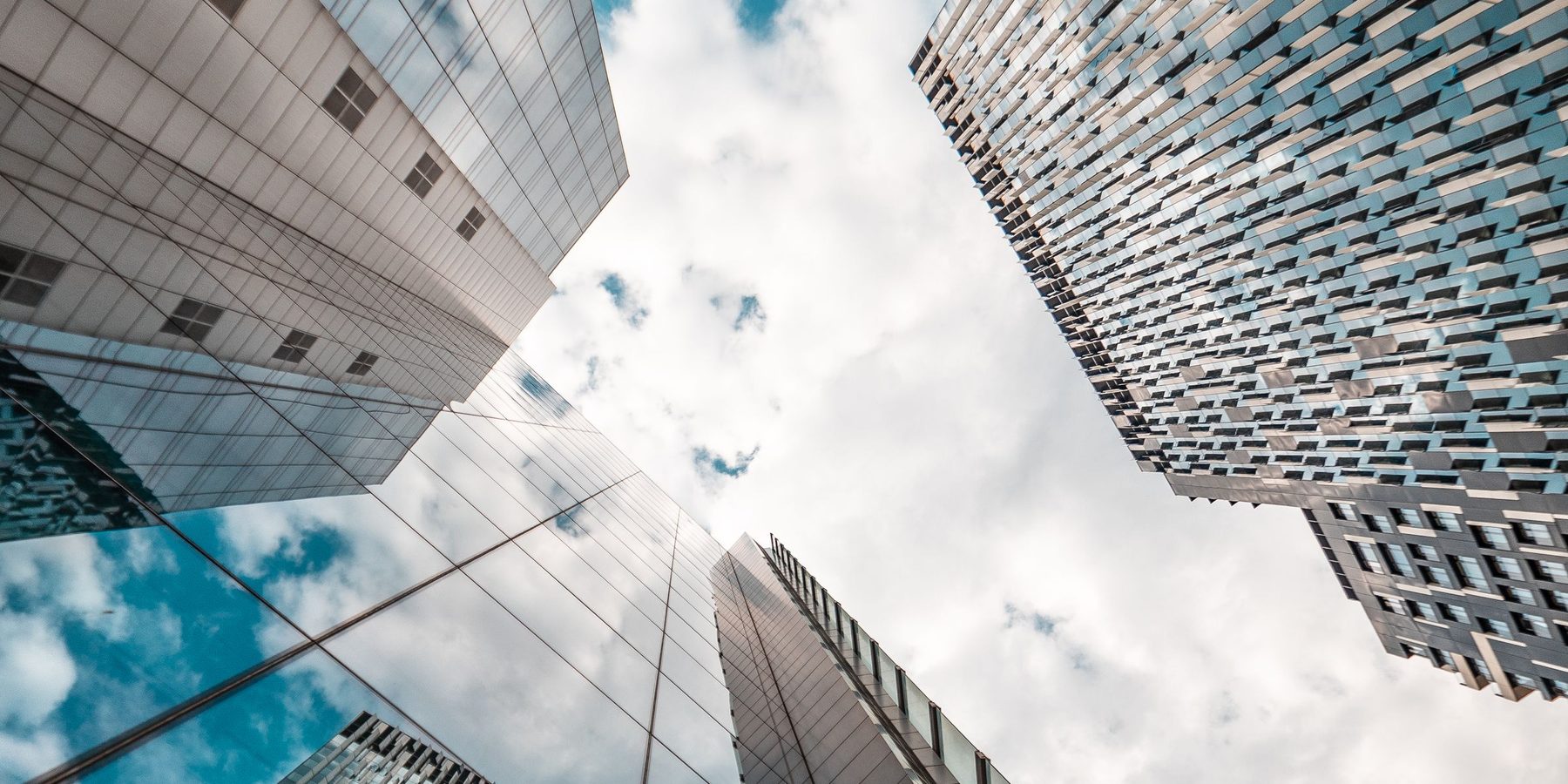 Glass office towers seen from below